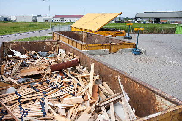 Big iron dumpster with groundwood at a refuse dump